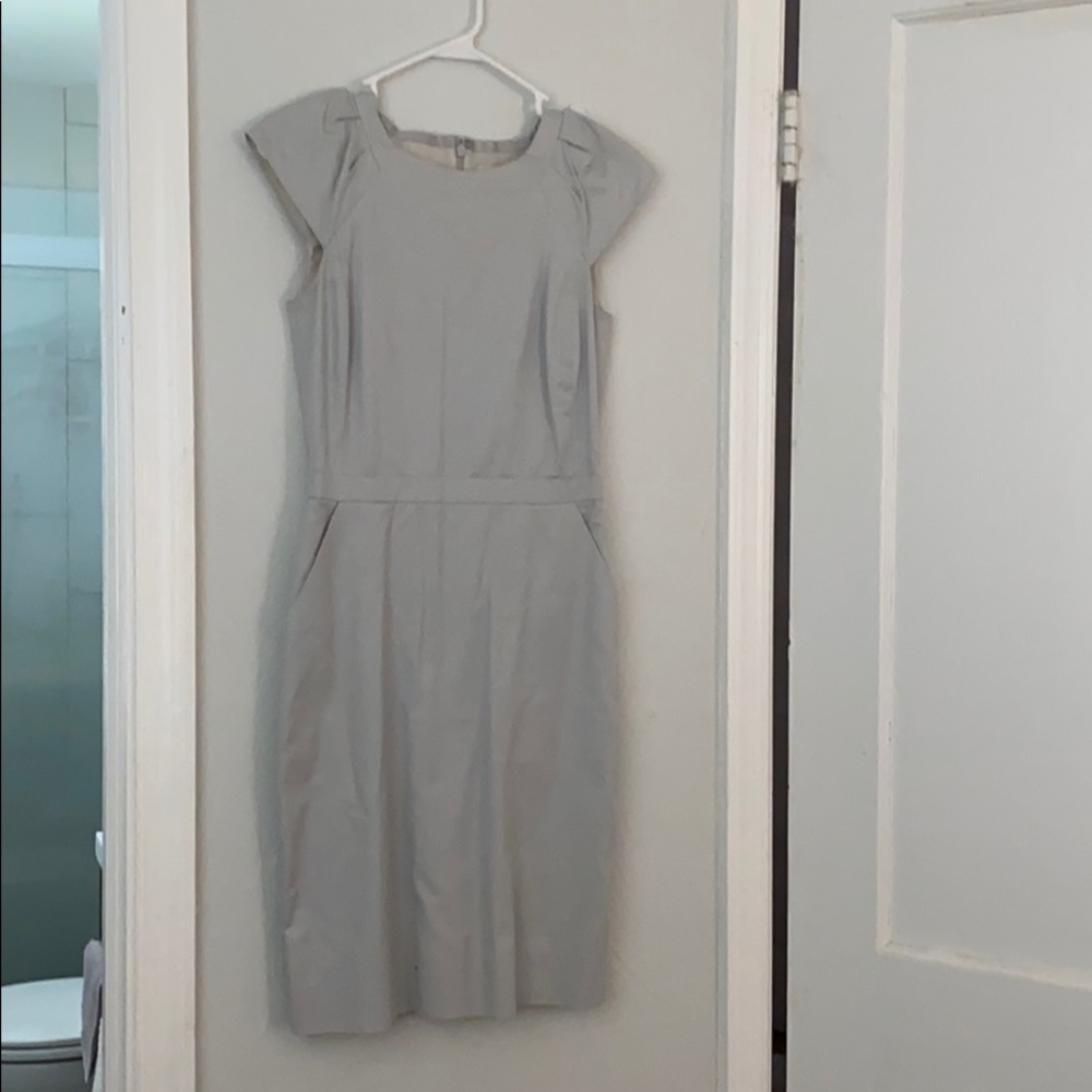 Grey sleek suiting work attire dress